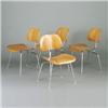 Image 1 : Four CHARLES EAMES for HERMAN MILLER DCM chairs with walnut finish on bright chrome tubular frame...
