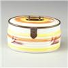 Image 1 : German oval biscuit box with yellow, orange and brown glazes on a white ground, with metal trim a...