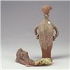 Image 1 : Two terra cotta items: a reclining nude figure with volcanic green glaze and a stoppered bottle,...