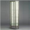 Image 1 : French Art Deco patinated metal vitrine with mirror back and three adjustable glass shelves. Unma...