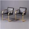 Image 1 : Pair of Brno-style armchairs with brushed brass finish, weighted based and black leather upholste...