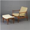 Image 1 : FINN JUHL teak armchair and ottoman upholstered in textured off-white fabric. France & Sons metal...