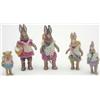 A family of 4 miniature early 20th century painted porcelain rabbits, fully jointed and clothed,...