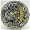Image 1 : A Palissy style circular wall plaque applied with 2 lizards and a snake, 9ins. £200-300...
