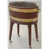 Image 1 : A George III brass bound mahogany wine cooler of oval form, with lead lining and brass handles, o...