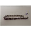 Image 2 : 925 MARKED STERLING SILVER RUBY BRACELET. OVAL SHAPED STARBURST CLUSTER OF 24