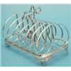 Image 1 : A Victorian silver 6 division toast rack with scrolled feet, 1846 (7ozs) £120-150...