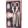 Image 1 : A 19th century Continental leather cased sewing set with scissors, pin cushion, tape measure, twe...