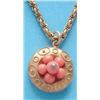 Image 1 : A Victorian gold and coral bead circular pendant, the reverse with plaited hair compartment, on a...