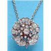 Image 1 : A late Victorian gold and silver diamond set brooch/pendant designed as a single wild rose, on a...