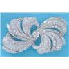 Image 1 : A French 18k white gold all diamond brooch of swirl design pave-set round and baguette cut diamon...