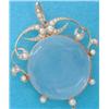 Image 1 : A gold mounted circular pendant locket, the scrolled frame set seed pearls £200-300...