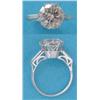 Image 1 : A solitaire diamond ring, the brilliant cut stone claw set in white gold with baguette cut diamon...