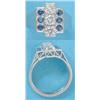 Image 1 : A platinum dress ring, the rectangular bezel set 3 brilliant cut diamonds flanked by 6 sapphires...