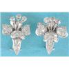 Image 1 : A pair of white gold diamond set flowerhead earclips  £1000-1500...