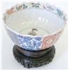 Image 1 : A famille verte fluted bowl with panels of fl...