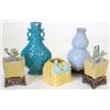 Image 1 : A pair of green, aubergine and yellow glazed...