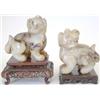 Image 1 : A pair of Qing jade or hardstone figures of s...