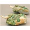 Image 1 : A mottled green, brown and celadon jadeite go...
