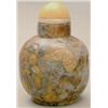 Image 1 : A puddingstone globular bottle carved with ba...