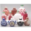 Image 1 : A red on white overlay glass bottle carved wi...