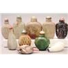 Image 1 : A spinach green jade disc-shaped bottle, lion...