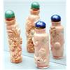 Image 1 : Two coral bottles, one carved with chrysanthe...