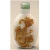 Image 1 : A mottled white, apple green and brown jadeit...