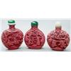 Image 1 : Three red cinnabar lacquer bottles variously...