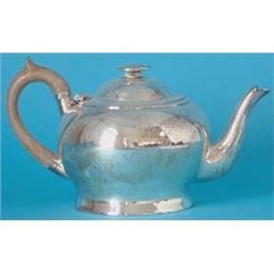 A George III silver compressed baluster teapot, the domed lid with circular finial, with curved s...