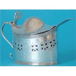 A George III silver oval mustard pot with bright cut decoration, the domed lid with pierced shell...