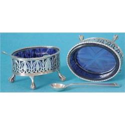 A pair of George III pierced silver oval salts with gadrooned rims, the sides with anthemion and...