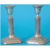 Image 1 : An Edwardian pair of silver dwarf candlesticks with vase shaped nozzles, reeded stems and square...