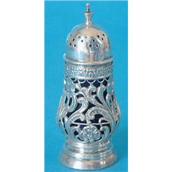 A late Victorian silver pear shaped sugar caster with domed lid and pierced foliate sides on dome...