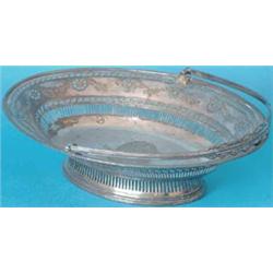 A George III Sheffield plated oval pierced cake basket with bright cut decoration and beaded rim,...