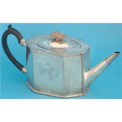 A George III Sheffield plated oblong octagonal teapot with tapering spout, ebony handle and finel...