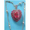 Image 1 : An early 20th century gold and silver heart shaped pendant set synthetic rubies, the central rect...