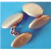 Image 1 : A pair of 9ct hollow gold oval cufflinks with chequer engraving and chain link connections Estima...