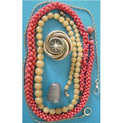 A Victorian gold circular brooch designed as entwined hoops, gypsy set with a split pearl, the re...