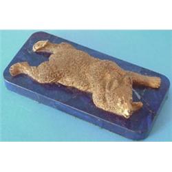 A late 19th century Russian gilt metal figure of a sprawling recumbent bear on lapis lazuli recta...