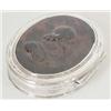 Image 1 : A silver mounted tortoiseshell oval snuff box, circa 1700, the lid moulded and carved in relief w...