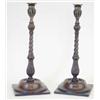 Image 1 : A pair of George III gilt metal and mahogany candlesticks, each with fluted vase-shaped nozzles,...
