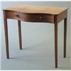 Image 1 : A late George III mahogany serpentine fronted side table with a drawer in the frieze on square ta...