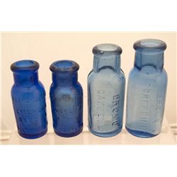 Nice group of four small bromo bottles