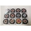 Image 1 : LOT OF 12 NHL SIGNED PUCKS INCL: BRETT HULL, MIKE MODANO, ROBERTO LUONGO, ADAM OATES AND MORE!