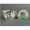 Image 1 : A Clarice cliff milk jug and sugar basin, in the Coral Firs pattern, painted in blue, black and g...