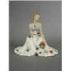 Image 1 : A Royal Dux figure of a seated lady with a wide flowing dress, circa 1940, 22cm high Est. 200/300...