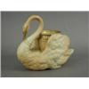 Image 1 : A Royal Worcester porcelain figure of a swan holding a basket between its wings, decorated in bur...