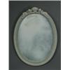 Image 1 : A Continental 'Jasperware' porcelain oval mirror surmounted with two cherubs supporting a fruit b...