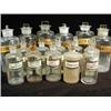 Image 1 : Sixteen Apothecaries bottles, each with a stopper and label, tallest 26cm Est. 70/100...